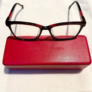 Carolina Herrera eyeglass frames—touches of red on subtle tortoiseshell pattern